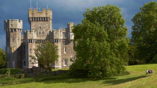 Visitors walking in the grounds at Wray Castle, Cumbria